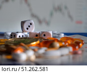 Gambling with Dice and Pills: Risk and Reward in Finance. Стоковое фото, фотограф Sergakoff / Фотобанк Лори