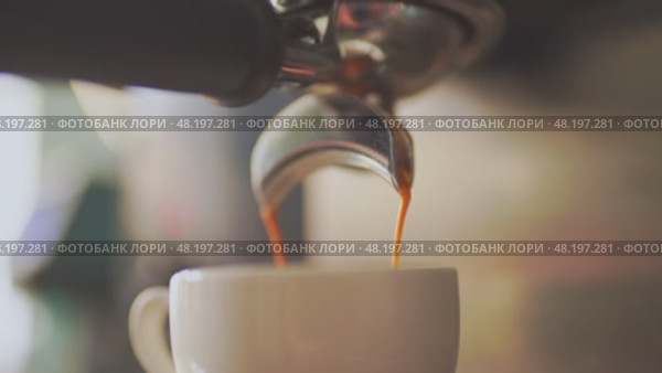 4k, espresso coffee is pouring from the coffee machine into a white cup, slow motion. Стоковое видео, видеограф Сергей Богомяко / Фотобанк Лори