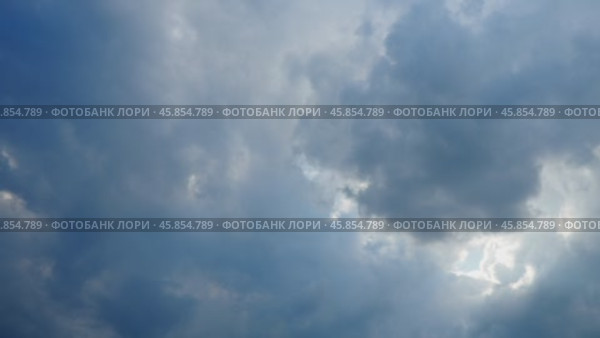 A blanket of dark clouds envelops the skyline, signaling an impending storm. The atmosphere becomes tense as the wind picks up and evening sets in. Time lapse. Стоковое видео, видеограф Юлия Петровская / Фотобанк Лори
