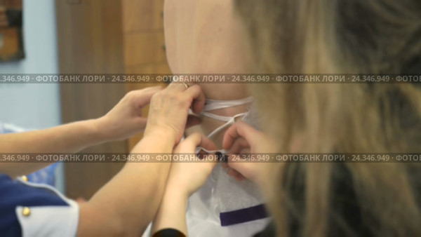 A bride getting dressed up for the wedding. Стоковое видео, видеограф worker / Фотобанк Лори