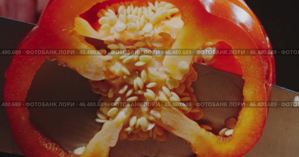 A Detailed CrossSection of a Bright Red Bell Pepper Clearly Revealing Its Seeds and Structure. Стоковое видео, видеограф Владимир Ковальчук / Фотобанк Лори