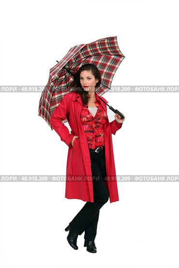 A fashionable woman holding an umbrella. Стоковое фото, агентство Ingram Publishing / Фотобанк Лори