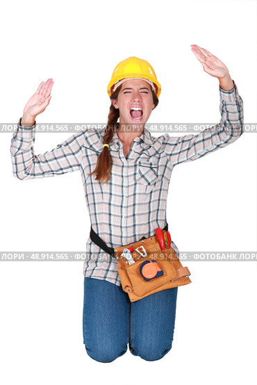 A female manual worker trapped in a box. Стоковое фото, агентство Ingram Publishing / Фотобанк Лори