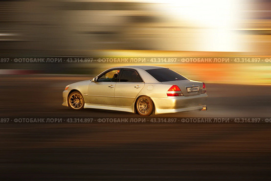 A high-speed drift car, in turn, is a supercar racing through the city at high speed. Стоковое фото, фотограф Ярославский Максим / Фотобанк Лори