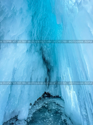 A large ice formation with a blue sky in the background. Стоковое фото, фотограф Олег Спиридонов / Фотобанк Лори