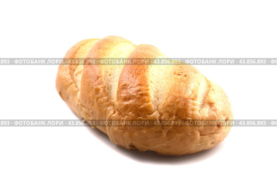 A loaf of fresh wheat bread on a white background. Стоковое фото, фотограф Ярославский Максим / Фотобанк Лори