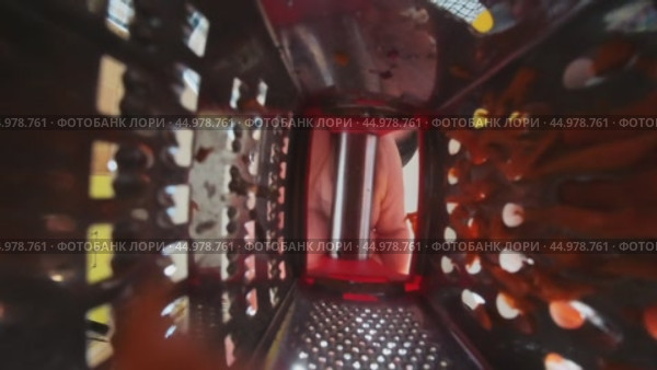 A man's hand puts a pyramidal grater on the table and grate carrots on it. Bottom view. Стоковое видео, видеограф Ярославский Максим / Фотобанк Лори
