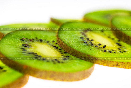 A pattern of fresh kiwi slices on a white background. Стоковое фото, фотограф Ярославский Максим / Фотобанк Лори