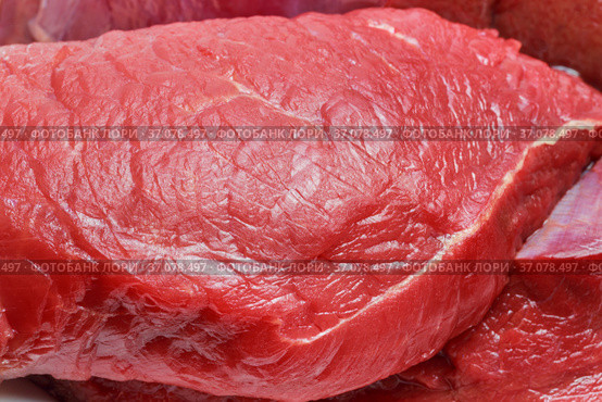 A piece of raw red meat beef fillet close-up. Food background. Source of vitamins B, A, amino acids, protein, collagen, choline. Стоковое фото, фотограф Светлана Евграфова / Фотобанк Лори