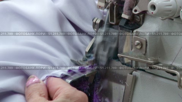 a seamstress scribbles clothes for dolls on a typewriter and smoothes it with an iron. Стоковое видео, видеограф Алексей Сергеев / Фотобанк Лори