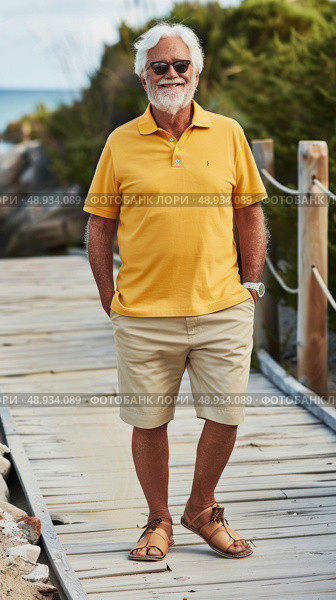 A senior man with a white beard is smiling and walking on a wooden path wearing a yellow polo shirt, khaki shorts, sunglasses, and sandals. Стоковое AI-изображение, AI-художник Данила Большаков / Фотобанк Лори