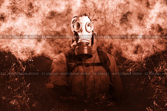 A shot of a man dressed in a gas mask, a hooded jacket, a backpack, reaching out for a handshake, looking into the camera. Poster on the background of grunge. Стоковое фото, фотограф Владимир Арсентьев / Фотобанк Лори