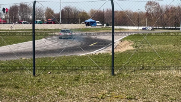 A sports car goes through a turn in a slide. Slow motion. Стоковое видео, видеограф Ярославский Максим / Фотобанк Лори