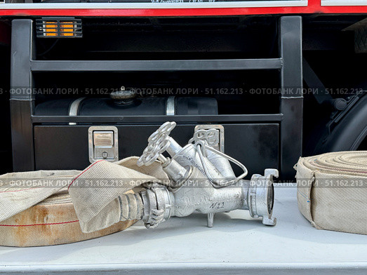 A water fire hose is lying. Стоковое фото, фотограф Соболева Наталия / Фотобанк Лори