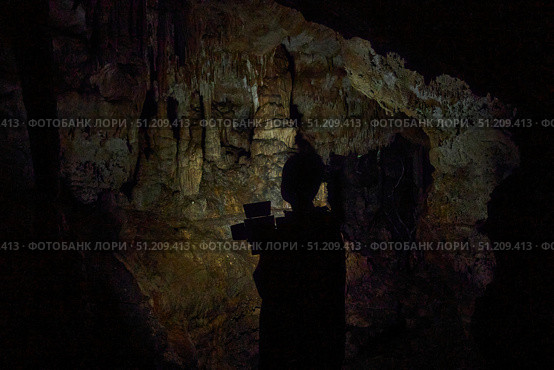 A wild cave inside. Stalactites and stalagmites. Speleology and surveys. Стоковое фото, фотограф Наталия Кирсанова / Фотобанк Лори
