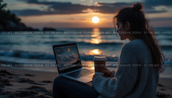 A woman is sitting on the beach with a laptop and a cup of coffee. Стоковое AI-изображение, AI-художник Ярославский Максим / Фотобанк Лори