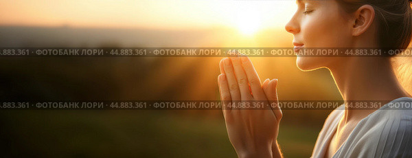 A woman praying peacefully at sunrise, bathed in warm light, symbolizing gratitude and hope for a new beginning. Стоковое AI-изображение, AI-художник Igor Tichonow / Фотобанк Лори