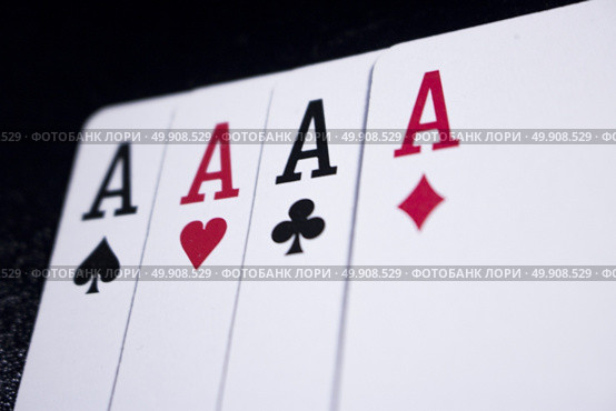 ace four of a kind poker card on dark black background. Стоковое фото, агентство Ingram Publishing / Фотобанк Лори