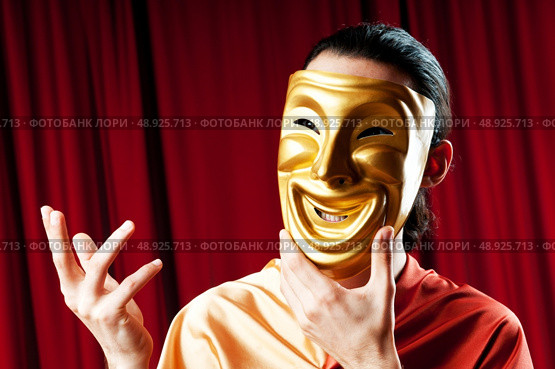 Actor with maks in a funny theater concept. Стоковое фото, агентство Ingram Publishing / Фотобанк Лори