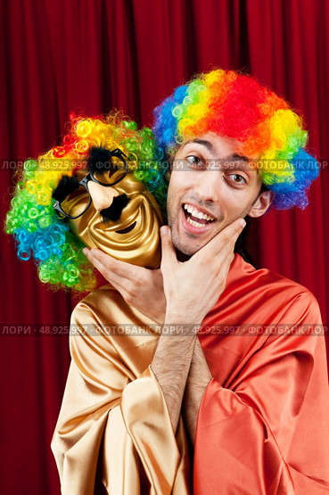 Actor with maks in a funny theater concept. Стоковое фото, агентство Ingram Publishing / Фотобанк Лори