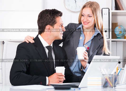 Adult business couple flirting in office. Стоковое фото, фотограф Яков Филимонов / Фотобанк Лори