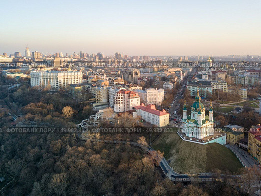 Aerial top view of Saint Andrew’s church and Podol district in city of Kiev , Ukraine. Drone photo. Panorama view of Podol and beautiful baroque St. Andrew’s Church in Kiev city, Ukraine. Стоковое фото, агентство Ingram Publishing / Фотобанк Лори