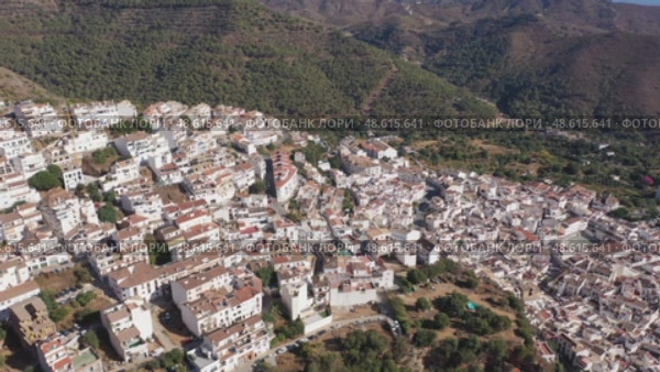 Aerial view of Ojen, white village over a hillside near Marbella, Spain in the spring. Стоковое видео, видеограф Яков Филимонов / Фотобанк Лори