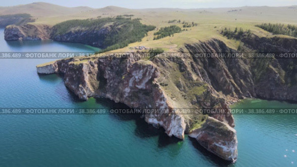 Aerial view on cape Sagan-Khushun on Olkhon island. Summer landscape of lake Baikal. (2022 год). Редакционное видео, видеограф Mixail59 / Фотобанк Лори