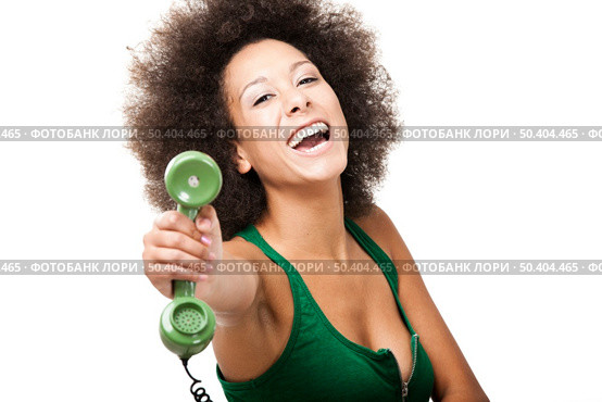 Afro-American young woman answering a call, isolated on white background. Стоковое фото, агентство Ingram Publishing / Фотобанк Лори
