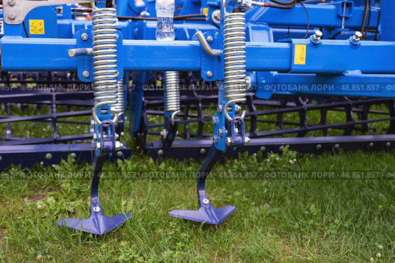 Agricultural machinery close-up with metal components and red frame. Стоковое фото, фотограф Вербицкая Светлана / Фотобанк Лори