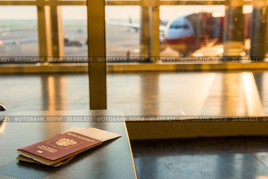 Airline tickets and documents on a background of an airplane. Стоковое фото, фотограф Константин Лабунский / Фотобанк Лори