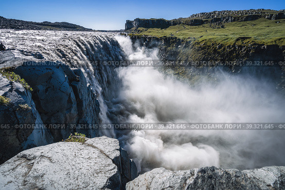 Amazing Iceland landscape at Dettifoss waterfall in Northeast Iceland region. Dettifoss is a waterfall in Vatnajokull National Park reputed to be the most powerful waterfall in Europe. Стоковое фото, фотограф Igor Tichonow / Фотобанк Лори