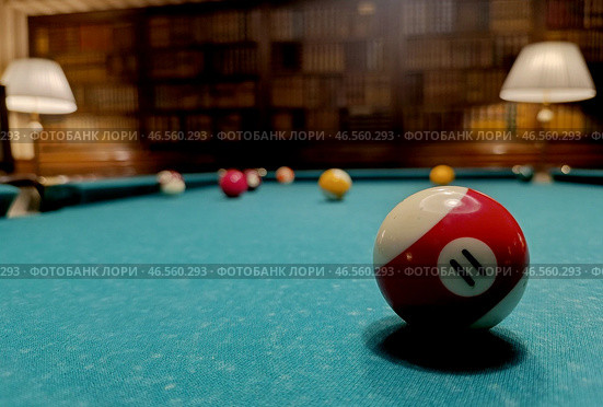 American billiards. The balls are on the green billiard table. We spend time at home playing our favorite sports game. Стоковое фото, фотограф Photojuli / Фотобанк Лори