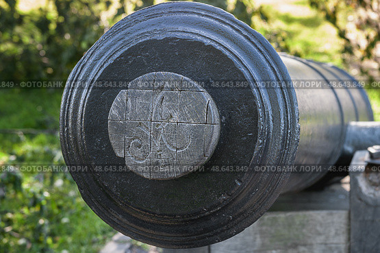 An antique cannon close-up. The muzzle of a smoothbore gun with a plug and the monogram A. Стоковое фото, фотограф Оксана Медведева / Фотобанк Лори