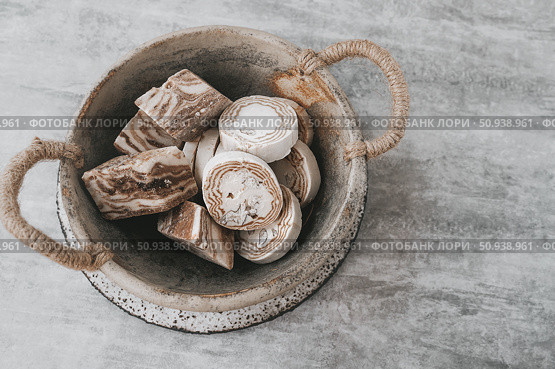 An assortment of oriental halva on a luxurious platter in the shape of two hearts. Round and sharp-angled shape of halva. Top view. Стоковое фото, фотограф Оксана Медведева / Фотобанк Лори
