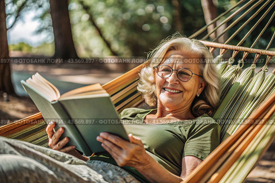 An elderly pensioner, a modern grandmother with glasses, reads a book on vacation in a hammock by the sea in natural light. Стоковое AI-изображение, AI-художник Photojuli / Фотобанк Лори