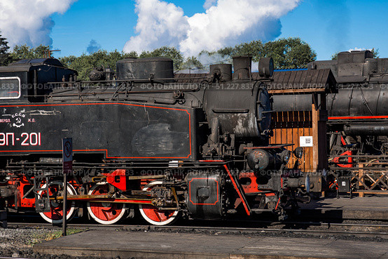 An old Soviet steam locomotive of the L series. The Ruskeala Express retro train is at the Sortavala station. Russia, Republic of Karelia, Sortavala, August 12, 2025. Редакционное фото, фотограф Photojuli / Фотобанк Лори
