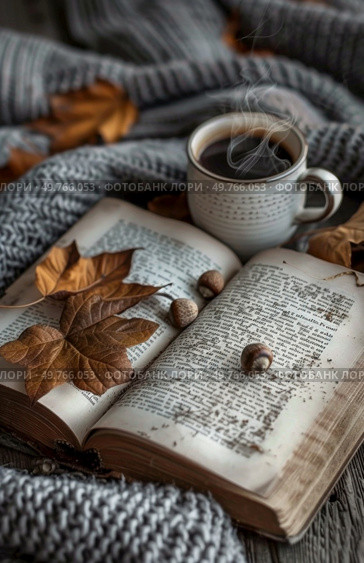 An open book with a cup of coffee placed on top of it.. Open Book With Cup of Coffee. Стоковое фото, агентство Ingram Publishing / Фотобанк Лори