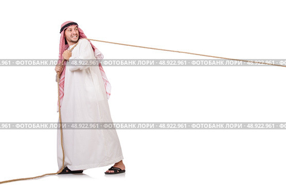 Arab in tug of war concept on white. Стоковое фото, агентство Ingram Publishing / Фотобанк Лори