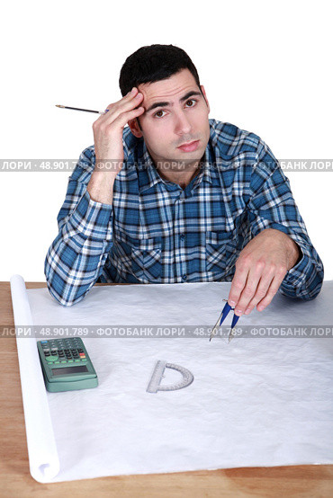Architect with drawings. Стоковое фото, агентство Ingram Publishing / Фотобанк Лори