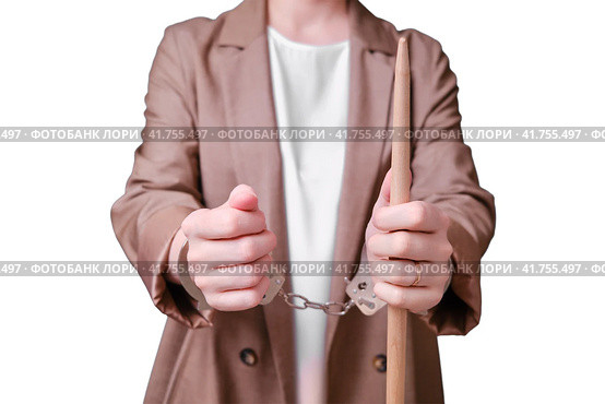 Arrested woman teacher handcuffed on a isolated on a white background, copy space. Стоковое фото, фотограф Андрей Журавлев / Фотобанк Лори