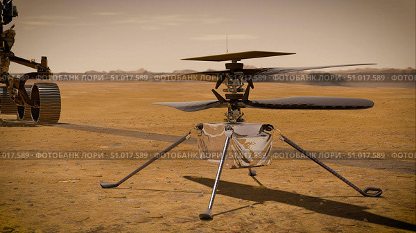 Artist's concept of the Ingenuity Mars helicopter on the Red Planet's surface. Стоковое фото, фотограф Stocktrek Images, Inc. / ТАСС / Фотобанк Лори