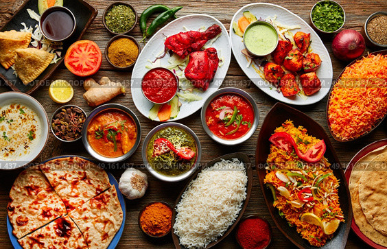 Assorted Indian recipes food various with spices and rice on wooden table. Стоковое фото, агентство Ingram Publishing / Фотобанк Лори