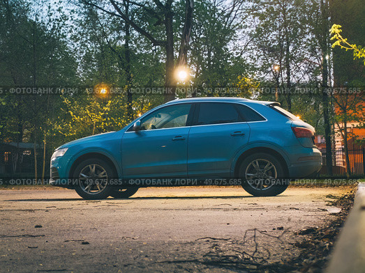 Audi RS Q3 luxury sporty SUV car parked on street in evening. Редакционное фото, фотограф Константин Григорьев / Фотобанк Лори
