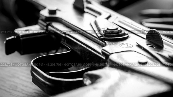 Automat or Kalashnikov carbine on a wooden background. Стоковое фото, фотограф Igor Skripachev / Фотобанк Лори
