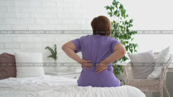 Back pain, kidney inflammation, woman suffering from backache at home, health problems concept. Стоковое видео, видеограф Станислав Тарко / Фотобанк Лори