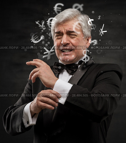 Bad Investment concept. Sad business man with currency symbols. Стоковое фото, фотограф Kirill Kedrinskiy / Ingram Publishing / Фотобанк Лори