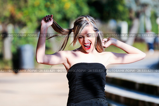 Beautiful and fashion girl with pigtails shouting and dancing. Стоковое фото, фотограф Javier Sánchez Mingorance / Ingram Publishing / Фотобанк Лори