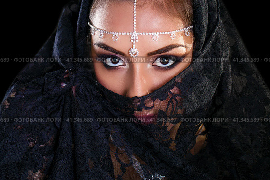 Beautiful Woman in Middle Eastern Niqab veil on isolated black background. Стоковое фото, фотограф Андрей Аркуша / Фотобанк Лори