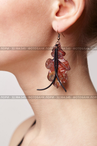 Beautiful woman with galvanic earring in form of oak leaf. Стоковое фото, фотограф Сергей Пристяжнюк (Serg Zastavkin) / Фотобанк Лори